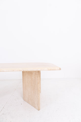Minimalist travertine table on a white background
