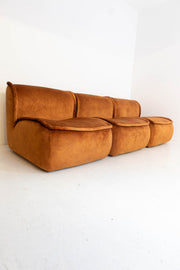 Vintage modular brown sofa on a white background