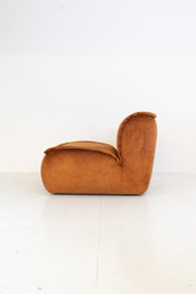 Modular vintage brown suede armchair on a white background