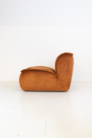 Modular vintage brown suede armchair on a white background