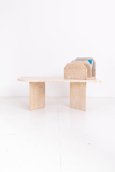 travertine table with travertine magazine rack on a white background