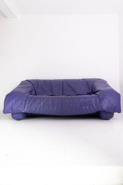 Purple leather sofa on a white background
