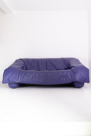Purple leather sofa on a white background