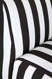 close up of black and white striped upholstery on Amanta 24 armchair. 