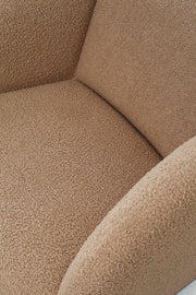 Close-up of latte bouclé upholstery on modernist Paulin Ben armchair by Artifort. 