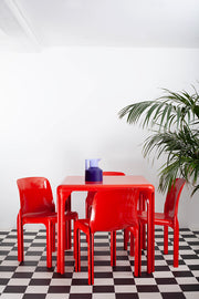 Magistretti Stadio table and stacking chairs red