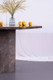 Small rust coloured marble dining table