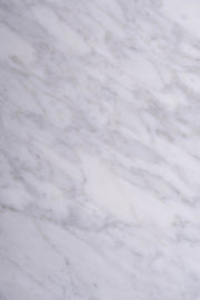 Detail shot of veining on Carrara marble coffee table