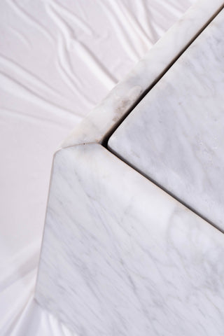Close-up of damage to vintage marble coffee table