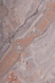 Detailed shot of grey and orange marble table top