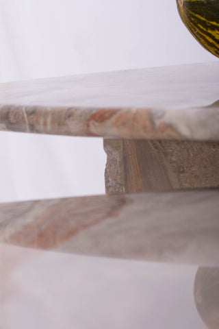 Close-up shot of vintage marble nesting tables in slate grey and tangerine orange 