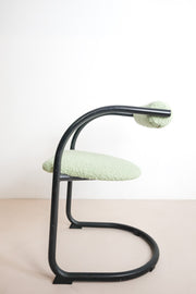 black dining chair with green fluffy upholstery