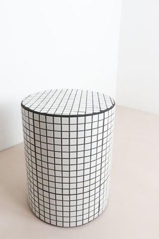 White tiled bedside table
