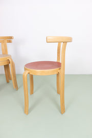 Wooden stacking chair with curves and coloured seat